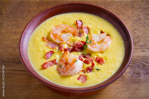 Shrimp, bacon and corn chowder. Creamy corn vegetable soup with shrimps and bacon. horizontal