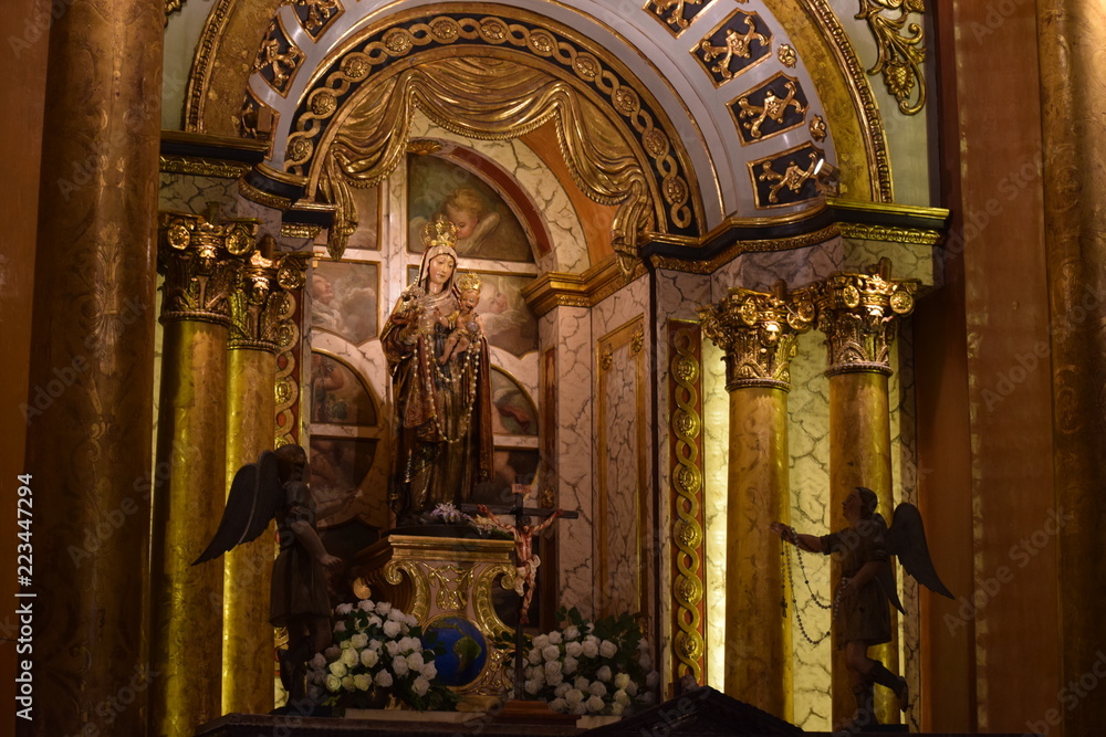 Interior photo of a statue of the Virgin Mary inside a church
