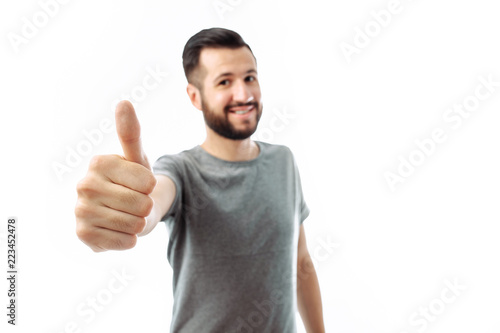 Portrait of emotional hipster man who shows class, finger, on white background,