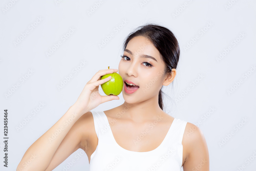 Portrait asian woman smiling holding eating green apple fruit and beautiful body diet with fit isolated on white background, girl weight slim with cellulite or calories, health and wellness concept. Portrait asian woman smiling holding eating green apple fruit and beautiful body diet with fit isolated on white background, girl weight slim with cellulite or calories, health and wellness concept.