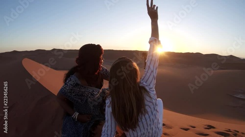 Action camera records sunset in desert, POV
