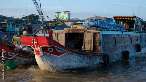 Tourists, people buy and sell food, vegetable, fruits on vessel, boat, ship in Cai Rang floating market, Mekong River. Royalty stock image of traffic on the floating market or river market in Vienam photo