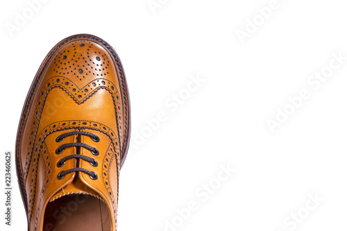Foto Extreme Closeup of Medalion of One Separate Male Tan Brogue Oxford Shoe