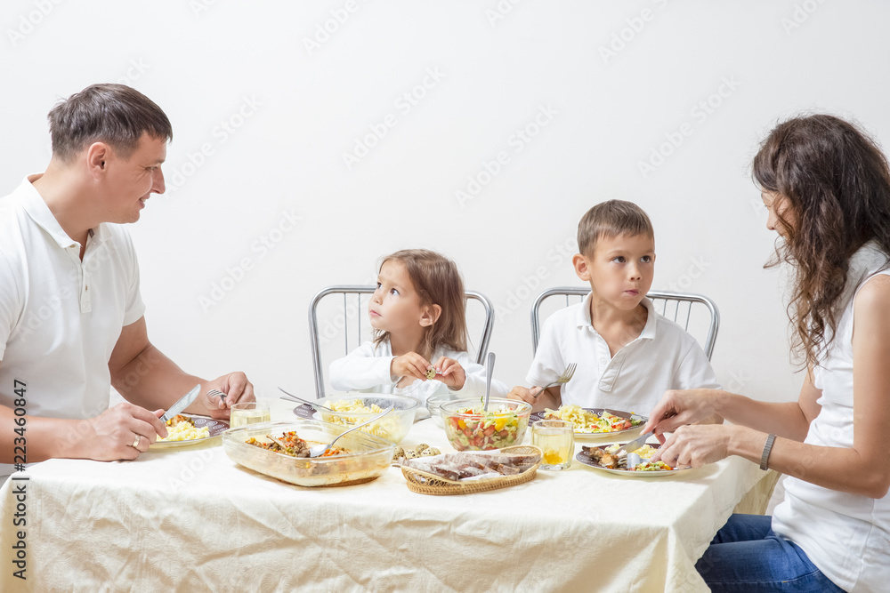 Family Concepts and Ideas of Combined Eating. Happy Parents with Their Children Having Breakfast at Home Together. Family Concepts and Ideas of Combined Eating. Happy Parents with Their Children Having Breakfast at Home Together.