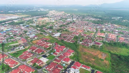 4K aerial high altitude footage of flying through a multi-racial village in Johor Bahru Malaysia photo