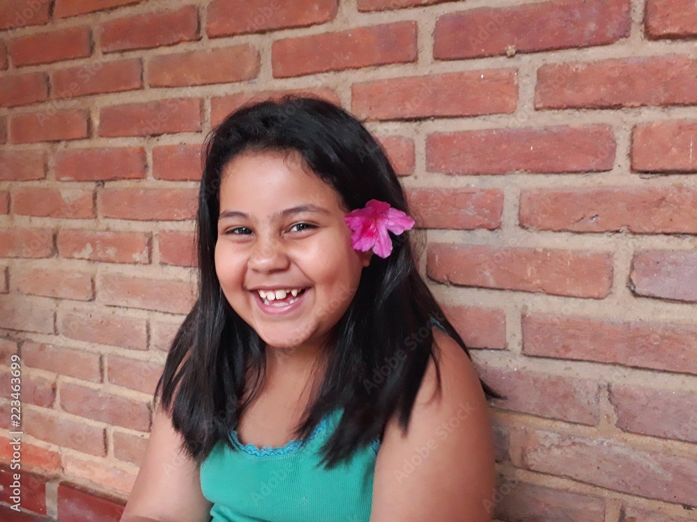 girl in front of brick wall girl in front of brick wall