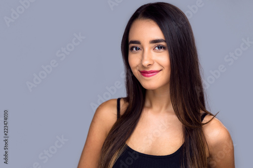 Commercial friendly hispanic girl with a nice genuine look of content, casual headshot