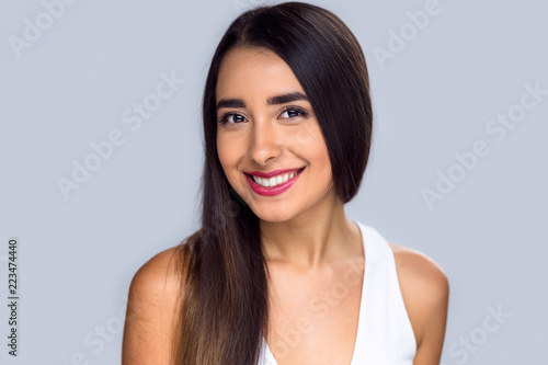 Latino youth teenager with a perfect straight white teeth smile