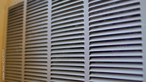 Slow move in on slighly dusty air conditioning vent