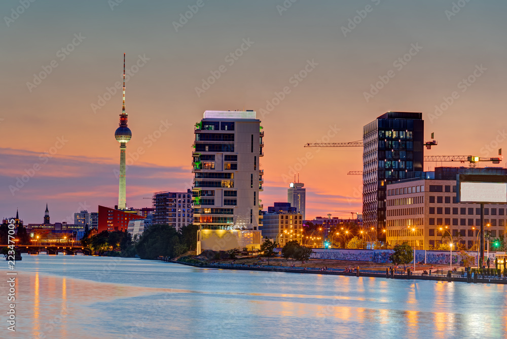 Dusk at the river Spree in Berlin with the famous Television Tower in the back