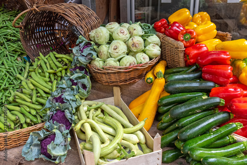 Courgettes, kohlrabi and other vegetables for sale at a market in Brixton, London