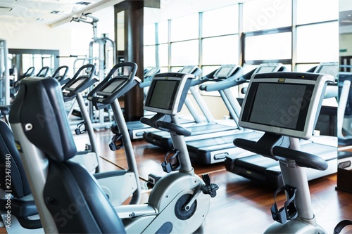 Modern gym interior with equipment, fitness exercise