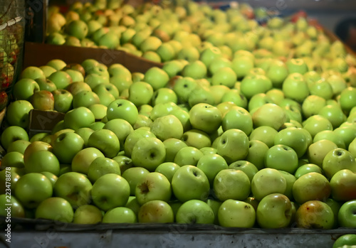 green apples on the market at night