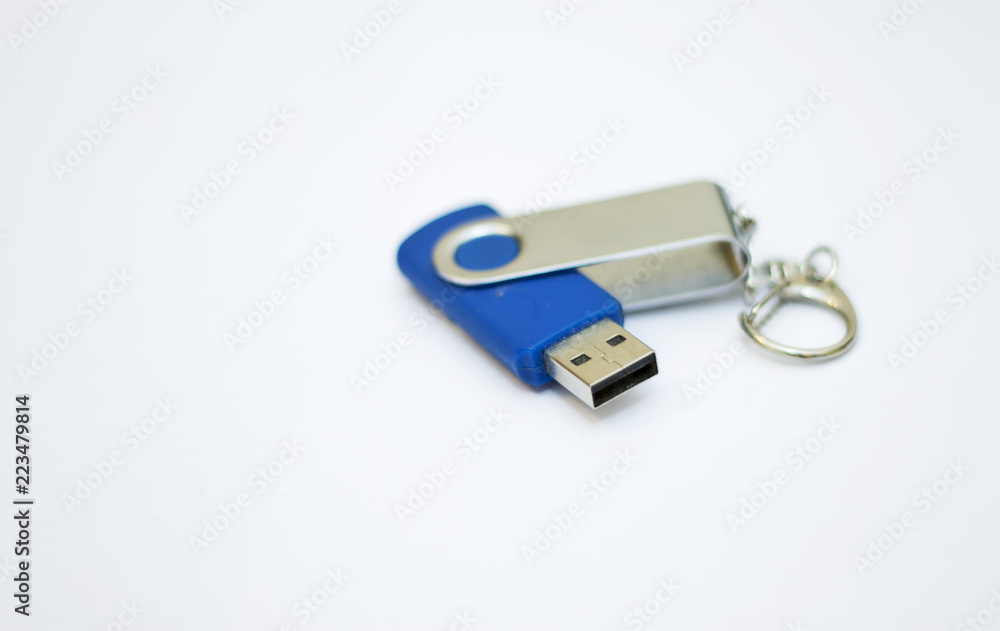 Blue usb flash drive for storing information on a white background close-up Blue usb flash drive for storing information on a white background close-up