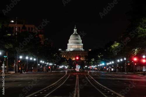 The U.S. Capitol at night as seen from an empty Pennsylvania Avenue