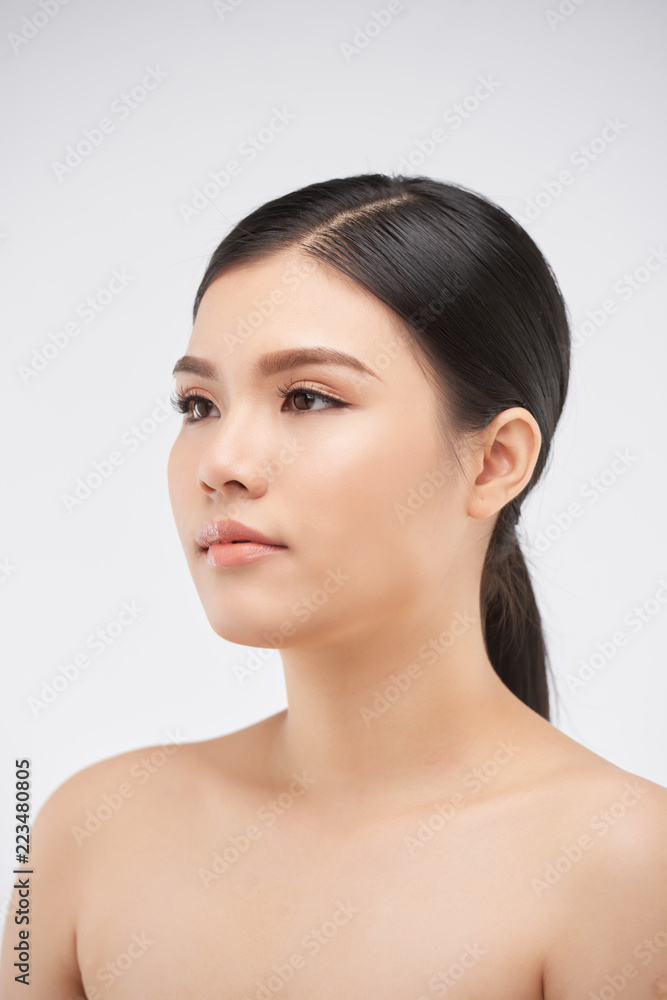 Studio portrait of attractive unsmiling young Asian woman Studio portrait of attractive unsmiling young Asian woman