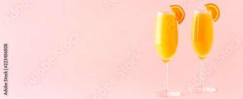 Yellow cocktail on a bright background.