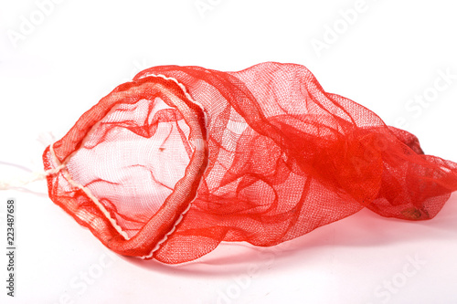 Vegetable red net bag isolated on white background