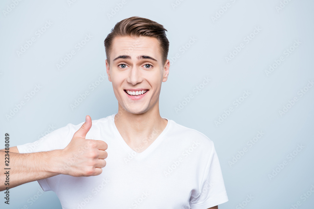 Close up portrait of attractive man look at camera with white ho Close up portrait of attractive man look at camera with white ho