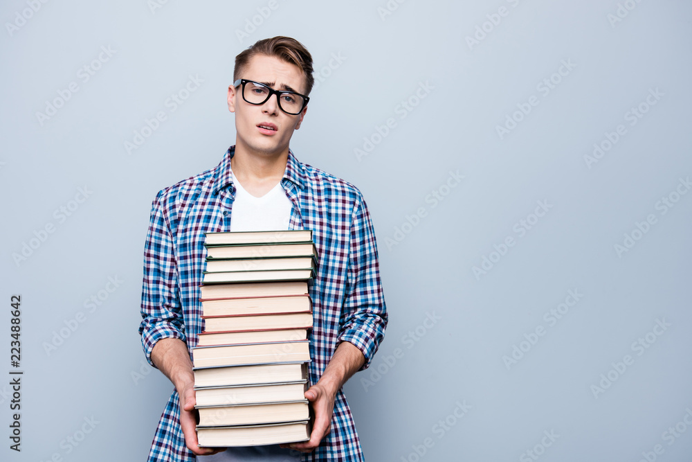 Portrait of tired, upset man in checkered shirt, eyeglasses, eye Portrait of tired, upset man in checkered shirt, eyeglasses, eye