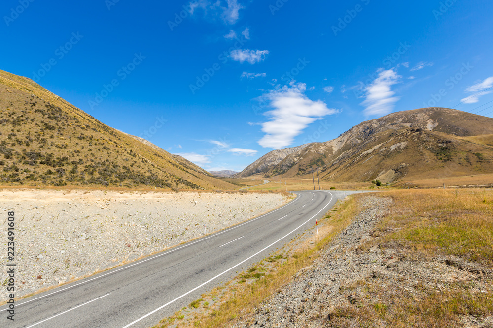 Beautiful scenic summer mountain view and asphalt ways in arthur pass national park south island New Zealand Beautiful scenic summer mountain view and asphalt ways in arthur pass national park south island New Zealand