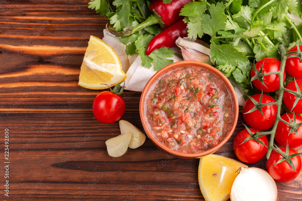 Traditional mexican red spicy sauce salsa with ingredients Traditional mexican red spicy sauce salsa with ingredients