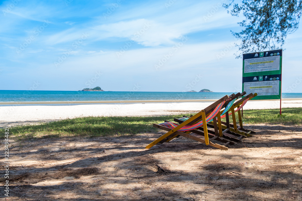 Colorful empty red and blue deckchairs on the beach,chair on the Thailand beach Colorful empty red and blue deckchairs on the beach,chair on the Thailand beach
