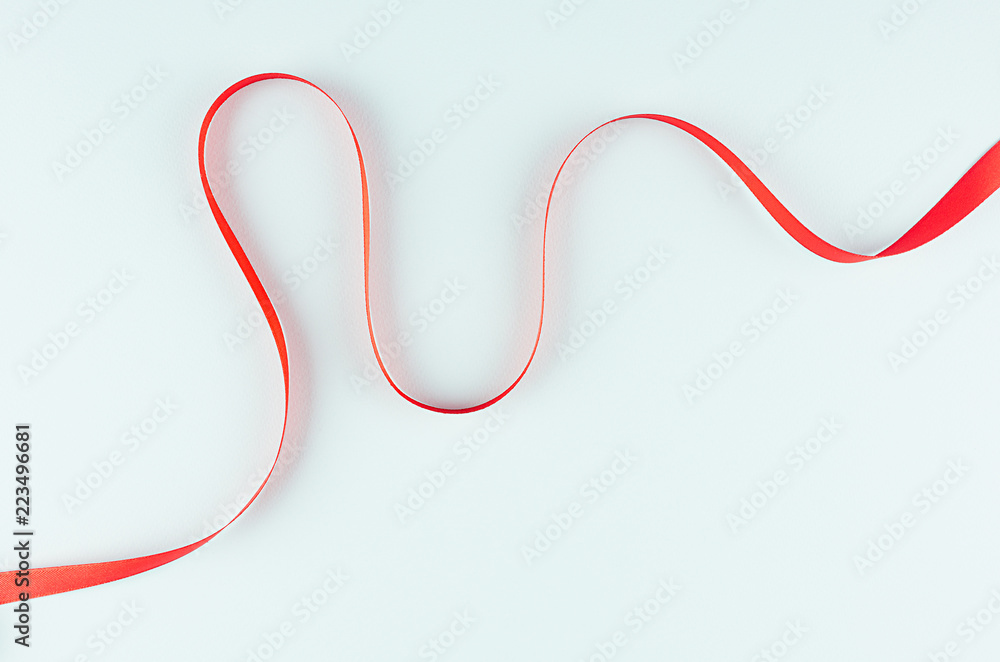 Red smooth love line on pastel mint background. Abstract elegant minimalist backdrop.