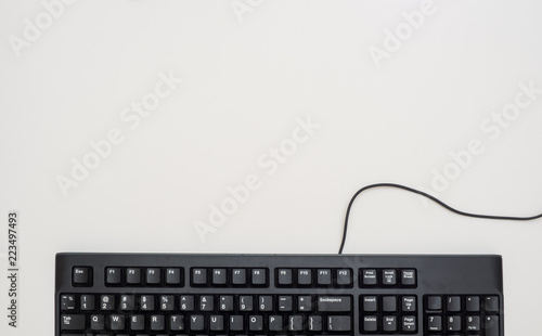 Office desk table with keyboard black Top view copy space on white background