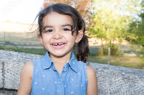 smiling pretty child girl happy in park outdoor