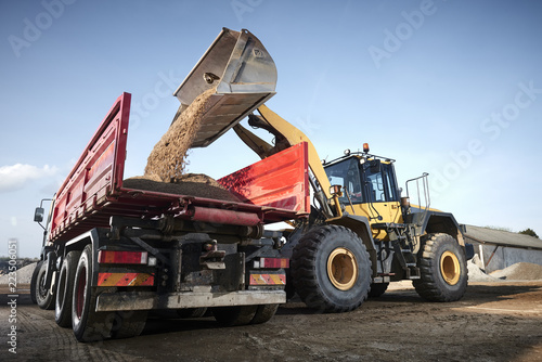 Excavator moving sand in a gravel pit