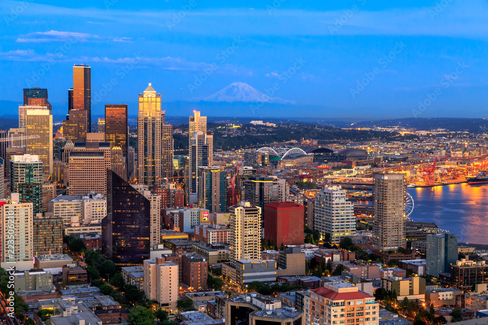 Seattle skyline panorama in blue hour with Mt. Rainier in background as seen from Space Needle Tower, Seattle, Washington, USA. Travel USA.