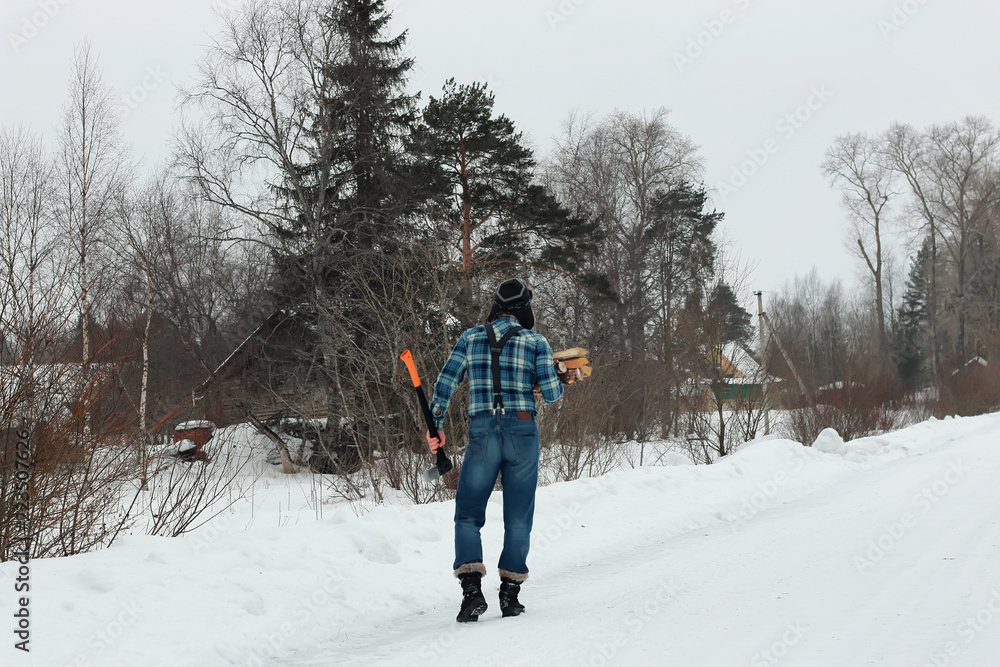 man in winter with axe