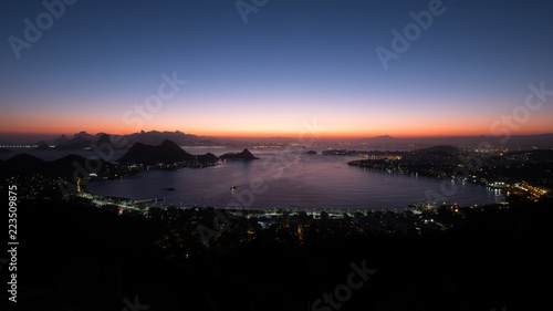 Brazil, Rio de Janeiro. Meeting the sunset. Top view of the city, lanterns, ocean, hills