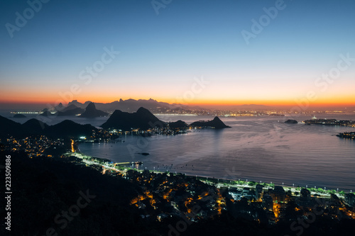 Brazil, Rio de Janeiro. Meeting the sunset. Top view of the city, lanterns, ocean, hills
