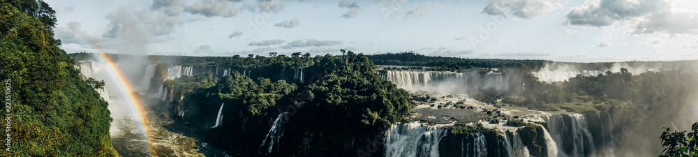 Brazil, the Iguazu Falls. One of the biggest waterfalls in the world. Waterfall and rainbow. Panorama Brazil, the Iguazu Falls. One of the biggest waterfalls in the world. Waterfall and rainbow. Panorama