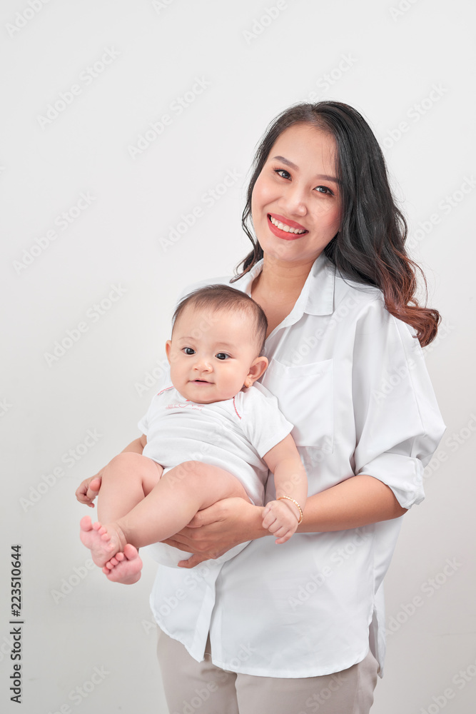 Happy loving family. Young smiling mother hugging laughing baby. Happy loving family. Young smiling mother hugging laughing baby.