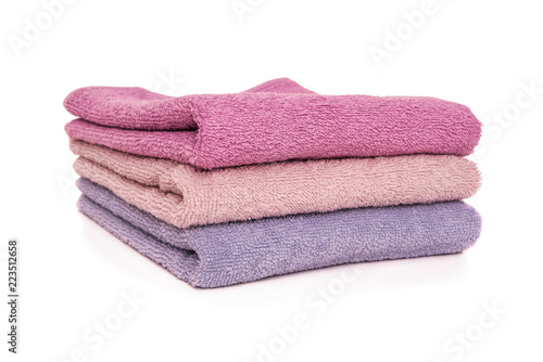 Terry towels. They are stacked vertically on top of each other. © Tanya Rozhnovskaya