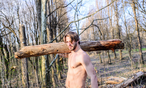 Lumberjack or woodman sexy naked muscular torso gathering wood. Man brutal  sexy lumberjack carry big log on shoulder. Strength and power. Man brutal  strong attractive guy collecting wood in forest Stock Photo |