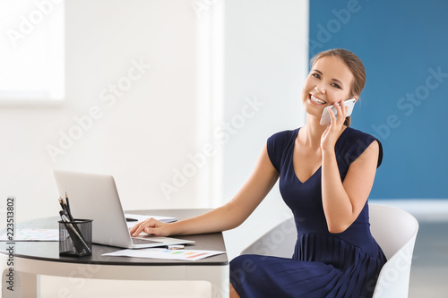 Young businesswoman working...