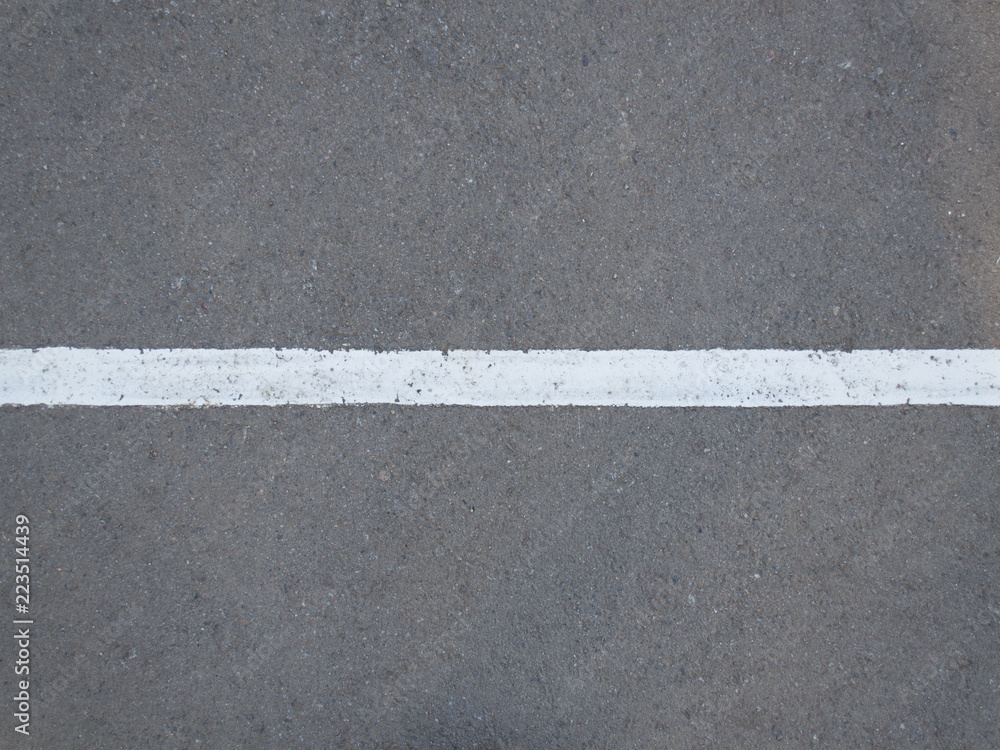 White strip on the gray asphalt