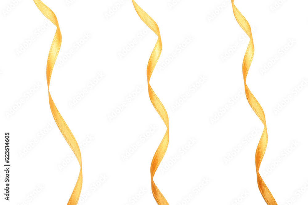 Curly golden ribbons on white background