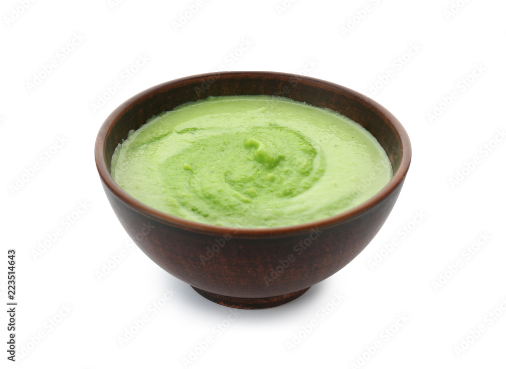 Tasty zucchini soup in bowl on white background