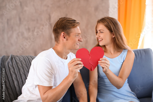 Young couple connecting hal...
