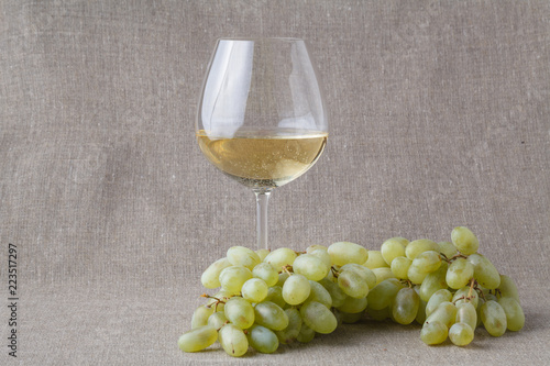 Glass of white wine and grape