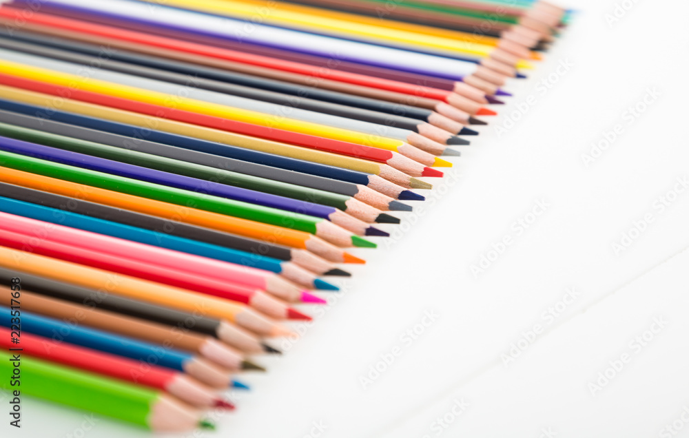 colored pencils lying in row colored pencils lying in row