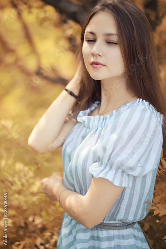 Young girl on a walk in the autumn 