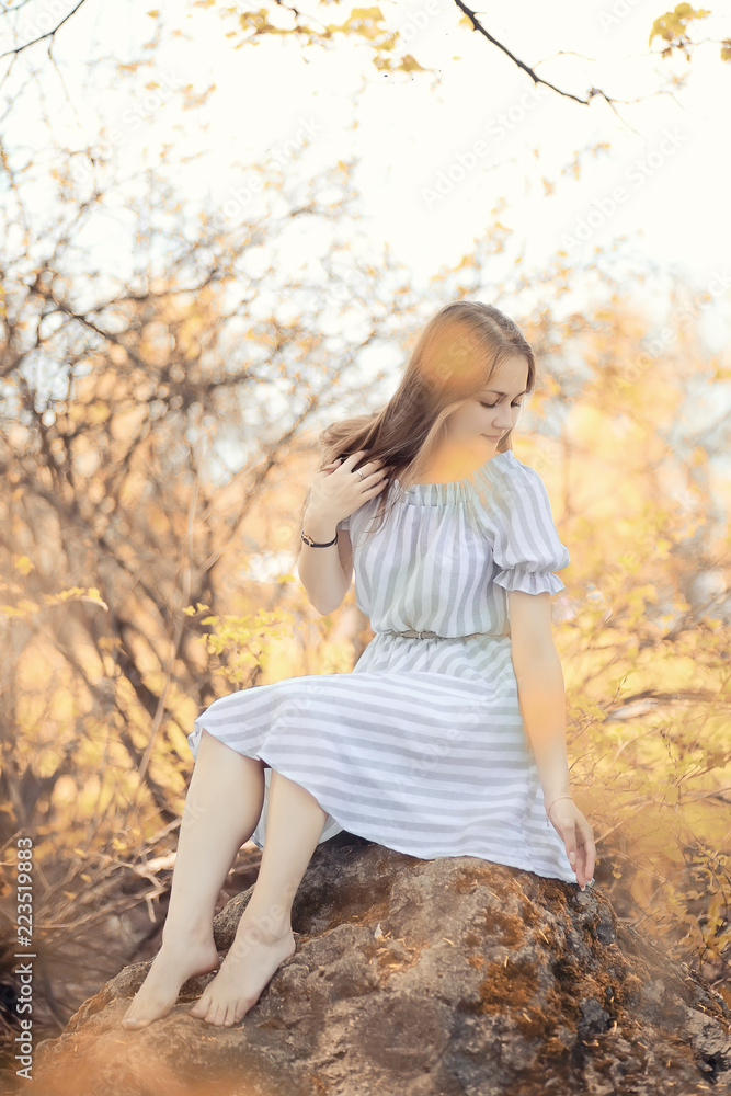 Young girl on a walk in the autumn Young girl on a walk in the autumn