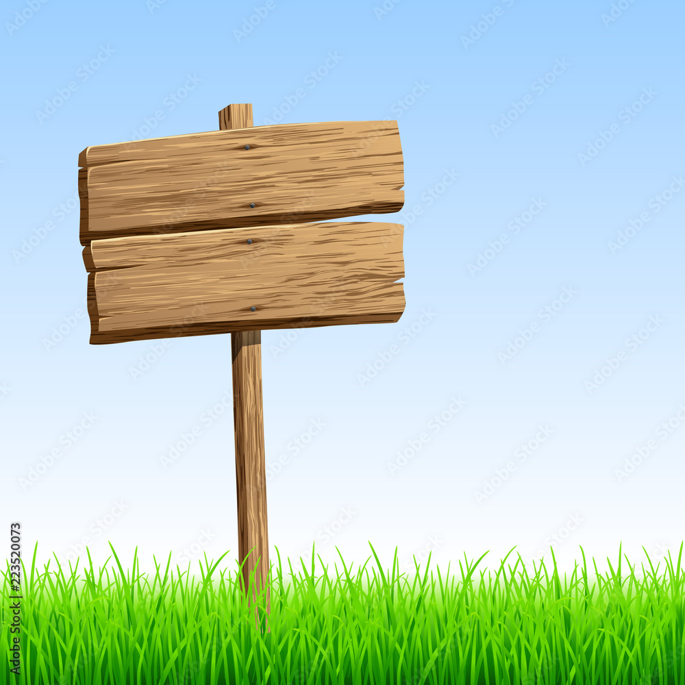 Wood signboard in grass Wood signboard in grass