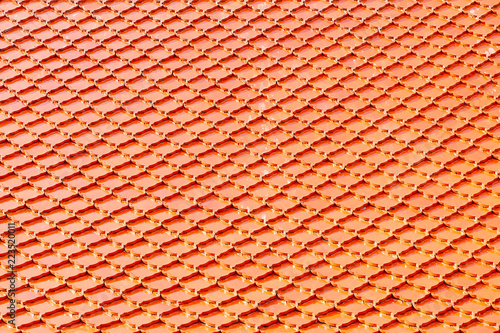 Orange tile roof at Buddhist temple. Square pattern background.